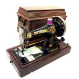 A Singer sewing machine in case