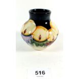 A small modern Moorcroft vase decorated candles c2005 - 8.3cm tall