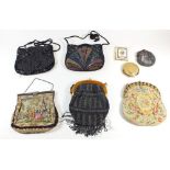 A small selection of vintage embroidered and beadwork purses and clutch hand bags together with some
