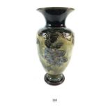 A Royal Doulton stoneware vase decorated with flowers, 27cm