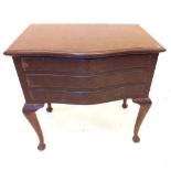 A Chinese hardwood serpentine fronted three drawer cutlery table, 76cm wide