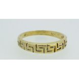 A 14ct gold ring with greek key design, size O - 2g