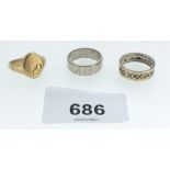 A 9ct gold signet ring 4.8g and an 18ct white gold wedding band with engraving and decoration, 6.