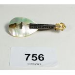 A continental mother of pearl brooch in the form of a lute