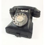 A vintage black bakelite telephone model 332L TE59/2A