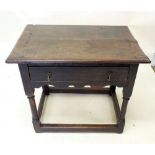 An early 18th century oak side table with single frieze drawer all raised on turned supports, 75cm
