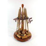 A vintage wooden table croquet set with mahogany stand & box, eight mallets, eight balls etc