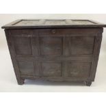 A late 17th or early 18th century deep oak coffer with panelled decoration