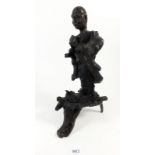 An Oriental root carving of a man, 29cm