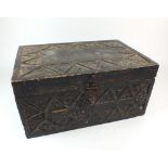 A stained wood and carved box, possibly Indian, 33cm wide