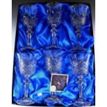 A boxed set of six Bohemian glass wine glasses