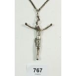 An Edwardian silver corpus crucifix pendant on chain, pendant hallmarked for Chester 1908. Gross