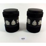 A pair of Wedgwood Black Basalt Jasperware lidded jars decorated heraldic coats of arms, various