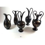 A group of five Italian black metallic finish vases & ewers decorated classical figures (one