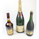 A bottle of Moet & Chandon champagne and a bottle of Remy Martin cognac champagne and a bottle of De