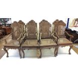 A set of eight Malaysian Colonial (Malaccan) carved hardwood dining chairs in mock Jacobean style