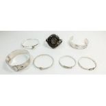 Four various silver bangles and three silver christening bangles