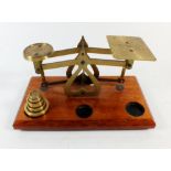 A small set of brass postal scales with weights