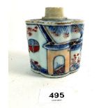 A Chinese tea caddy painted in underglaze blue and white with iron red garden scenes, 9cm, rim