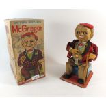 A Rosco battery operated McGregor smoking man toy boxed