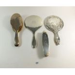 Two silver hand mirrors and two silver brushes
