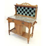 An Edwardian tile back and marble topped washstand