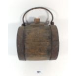 A 19thC farm labourers cider costrel with carrying handle, stamped to sides JSL. 15.5cm wide