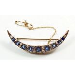 A Victorian gold crescent brooch set graduated sapphires and diamonds, 5cm, 4.9gm, unmarked