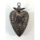 A silver heart form pendant or chatelaine box with embossed decoration, import mark for London 1902,