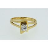 An 18ct gold solitaire diamond ring, .25cts - size M