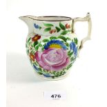 A 19thC Staffordshire pearlware jug with painted rose decoration, 13cm