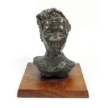 A mid 20thC modernist sculpture in form a bust of a man in a bronze finnish but formed of a grey