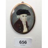 An early 19th century watercolour on ivory miniature portrait of a man in oval 18ct gold frame