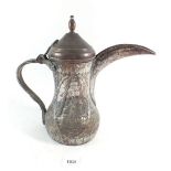 A Middle Eastern tinned copper coffee pot or Dallah, with engraved decoration, 31cm