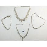 Four various silver necklaces