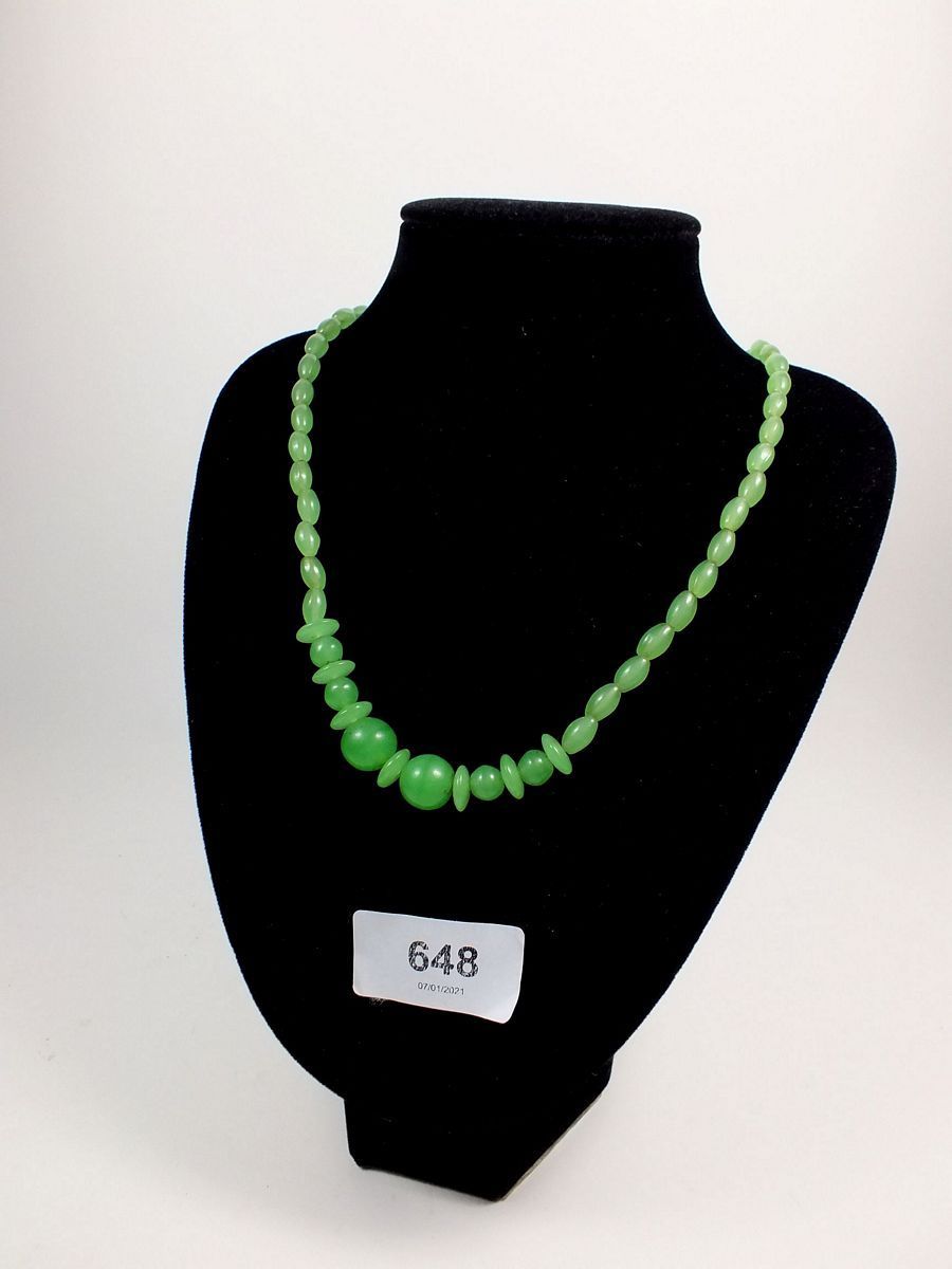 A carved jade bead necklace