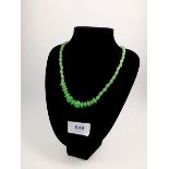 A carved jade bead necklace