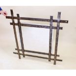 A hand crafted iron framed wall mirror 99cm square
