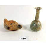 A small Roman iridescent glass vase, 9cm tall and a Roman pottery oil lamp