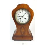 An Edwardian mahogany balloon shape mantel clock with inlaid urn decoration, 30cm