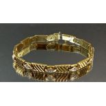 An 18 carat gold link and diamond set bracelet, 20cm long, 18.8g