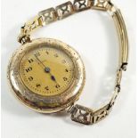 An early 20thC Elgin fob watch in yellow metal Montauk case mounted as a wristwatch