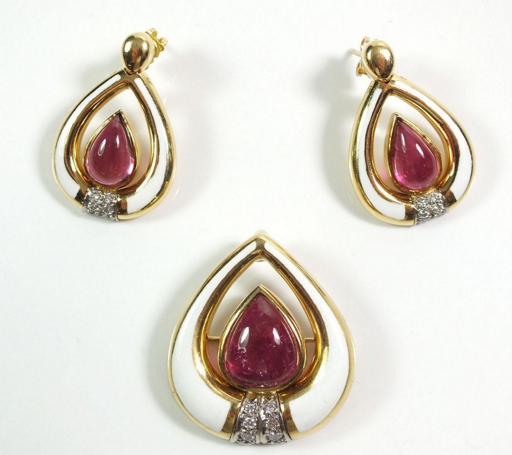 A Gerald Benney 18ct gold pair of earrings and matching brooch, all set with pear form rubelite