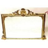 A 19th century French gilt framed overmantal mirror with shell and scrollwork surmount and side