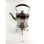 A silver plated tea kettle on stand with engraved decoration