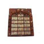 An early 20th century hand carved and fretwork cut gothic style wall decoration in the form of an