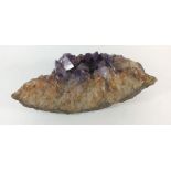 A large amethyst crystal, 27cm long