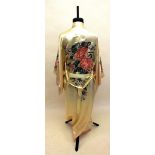 A 1930s Japanese cream silk Kimono with Chrysanthemum and other floral embroidery to front sleeves