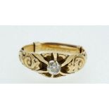A 14 ct gold ring set diamond in scrollwork mount and claw setting, size O-P