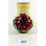 A Moorcroft vase painted hibiscus on a yellow ground, paper label to base, 106 cm
